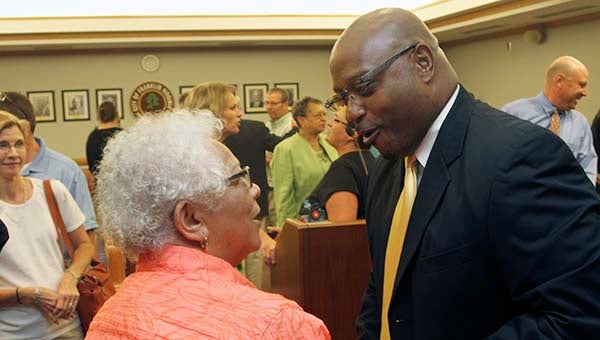 Willie Bell, Franklin’s new superintendent, greets city councilwoman Mary Hilliard. -- CAIN MADDEN | TIDEWATER NEWS