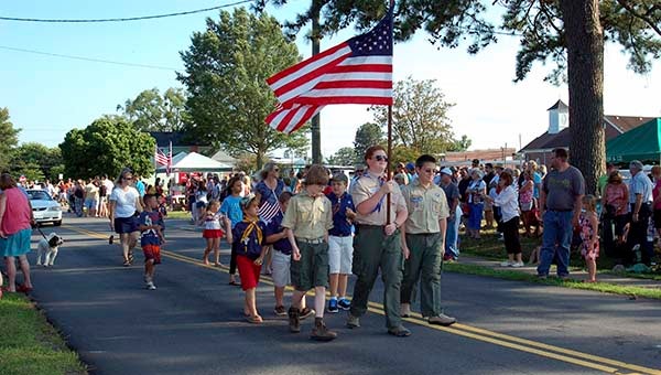 The Windsor Boy Scouts lead the annual Windsor Fourth of July parade. -- MERLE MONAHAN | TIDEWATER NEWS