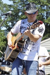 Dave Cynar of The Dave Cynar Band hits a note during his country music act at the Franklin Fourth of July Celebration. -- Frank Davis | Tidewater News