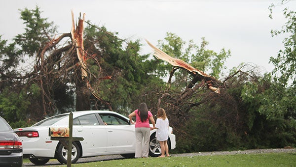 The Wright family of Buckhorn Quarter Road is visited by friends checking on them after the storm on Thursday. Photo by Cain Madden.