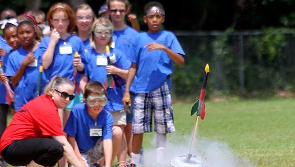 Whitman Clark, 9, of Capron, watches his rocket fire off. -- Cain Madden | Tidewater News