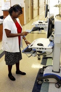 Lois Howell-Britt, RN, checks a computer at the long-term care center. Howell-Britt, the director of nursing, is over the long-term care center, where the new Self-Recovery detoxification program is located. Nurses use the computers to help set up the medication that patients will be using to detox over the 7-10 days that they are in the program at the hospital. -- Cain Madden | Tidewater News