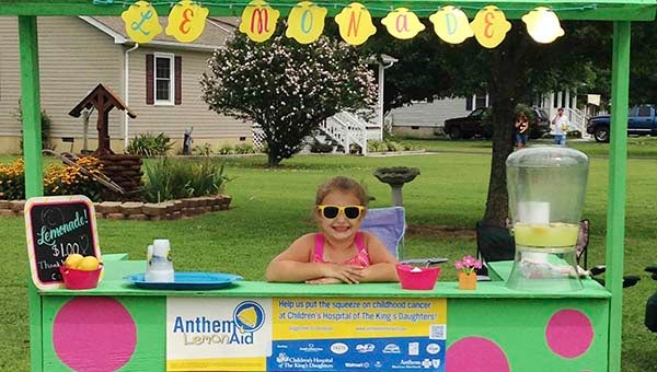 Cooper Bass, 6, set up a lemonade stand this past Saturday and raised $501 to help children with cancer. -- SUBMITTED