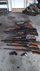 A lineup of guns recovered from a Branchville residence on Little Texas Road that have been connected with burglaries from around the region. -- SUBMITTED