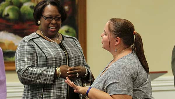 Jennifer Miguel, a new Franklin High School ninth-grade English teacher, meets with Mayor Raystine Johnson-Ashburn at the annual new teacher’s luncheon. Miguel has been teaching for 14 years, nine of those in Suffolk, and said she loves it here. -- CAIN MADDEN | TIDEWATER NEWS