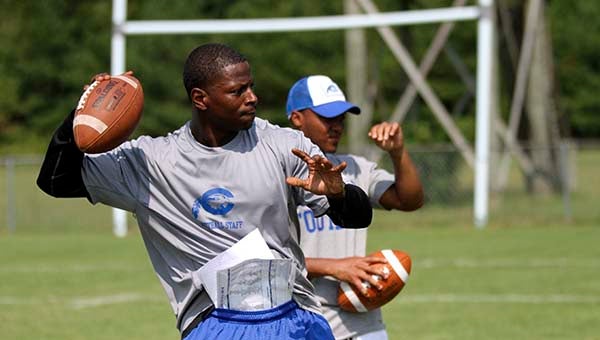 Chowan wide receivers coach Montario Hardesty throws the ball to his players. -- Cain Madden | Tidewater News