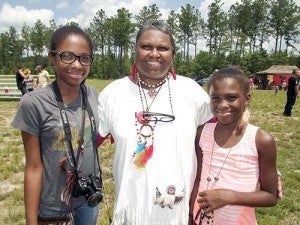 Claudette “Rain Flower” Orie of the Cheroenhaka (Nottoway) tribe came from Carrollton to attend the summer powwow. With her are grandchildren, Nia Orie, left, and Mya Orie -- Stephen H. Cowles | Tidewater News