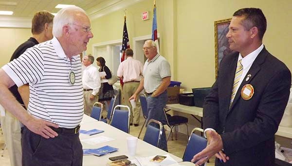 Franklin Rotarian Asa Johnson, left, talks with Del. Rick Morris after a recent presentation to the club. -- Stephen H. Cowles | The Tidewater News