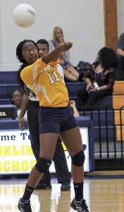 Catherine Brown looks to return a volleyball back across to the Lady Cougars. -- FRANK DAVIS | THE TIDEWATER NEWS