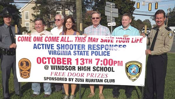 Virginia State Trooper Lt. Curtis Hardison, left, Buddy Doxie, Thomas Hardison, Tammy Edwards, Charles Powell, Tom Michaels and Isle of Wight County Sheriff Mark Marshall are promoting a meeting this month about active shooter responses. -- STEPHEN H. COWLES | THE TIDEWATER NEWS