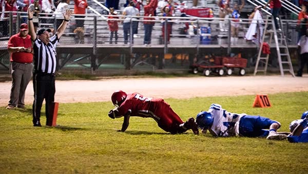 Coby Williams falls across the goal line for one of his touchdowns. -- MURRAY THOMPSON | TIDEWATER NEWS