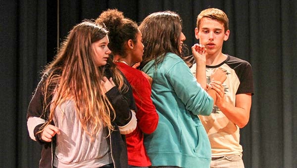 Franklin HIgh School students Angela Bird, in foreground, Summer Winston, Jamie Geary and Cameron Seddon rehearse a scene from “Cave Dream.” At far left is Karissa Scuermann. Not shown is Aaron Griffith. They and other students will perform the one-act play next week, including a competition against two other schools. -- CAIN MADDEN | THE TIDEWATER NEWS