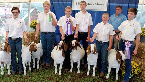 Members of the Southampton Livestock 4-H Club pose for a picture after the Market Goat Show with Ron Hughes (Judge) in the back. Included in the picture are Maryann Johnson, 12, of Drewryville; Wyatt Raiford, 12, of Franklin; Taylor Cross, 14, of Zuni; Brandon Raiford, 17, of Franklin; Lane Cross, 11, of Zuni; and Lee Johnson, 14, of Drewryville. -- SUBMITTED