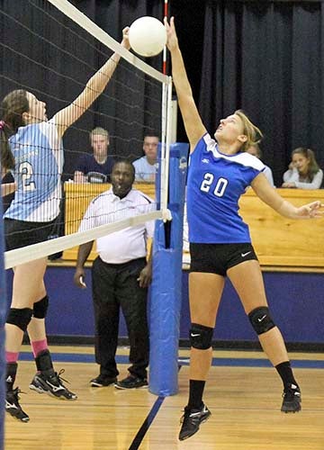 Southampton’s Sarah Best, right, battles Tidewater’s Taylor Laxton at the net. -- FRANK DAVIS | THE TIDEWATER NEWS