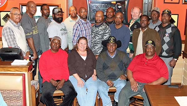 After eating a complimentary meal provided to all veterans including this photographer by Applebee’s, the group invited all veterans that were present in the restaurant to join with them in a photo. One couple that just happen to be traveling through Franklin and had stopped by Applebee’s was Cindy and Jim McDonald of Norfolk, who gladly accepted their invitation. Front, from left, Ernest Spratley, Cindy McDonald, Demetreious Mathews and Maryland Pope; back, in no particular order, Cullen Ricks, Ernest Freeman, Abraham Urquhart, Richard Bradshaw, James Hawks, Joseph Shearin, Ray Smith, Shelton Artis, Tony Smith, Jovan Stith, Edward Pierce, Antonio Jones, James Postell, Samuel Darden and Jim McDonald. -- Frank Davis | Tidewater News