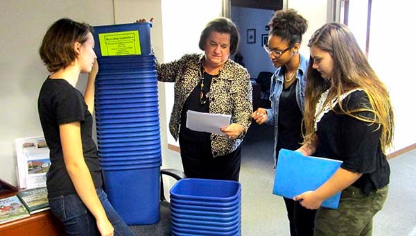 Nancy Parrish, center, with Vanessa Stone, left, Summer Winston and Angela Bird counting out the recycling bins for distribution. -- SUBMITTED
