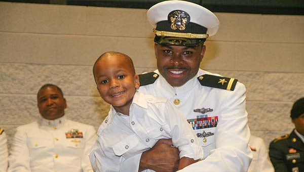 James T. Nichols hugs his son, Jacob, after being commissioned as a U.S. Navy officer. -- Frank Davis | Tidewater News