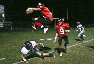 Daniel Brown moves to leap over a player back in high school at Isle of Wight Academy, as he makes a push for the goal line.