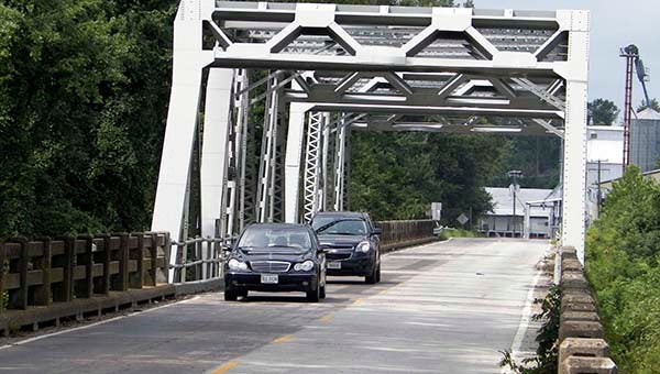 Two motorists drive across the Nottoway River bridge on Route 35 outside Courtland. The bridge will be closing on Jan. 5, 2015, with construction following. -- FILE PHOTO