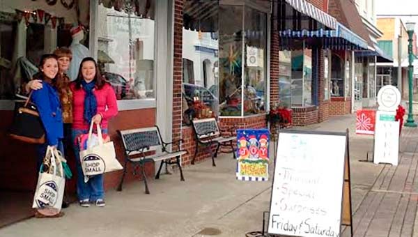 Small Business Saturday Shoppers Susan Falcone, left, and Megan Holland, right, stand with The Cat’s Meow small business owner Debbie Crowder on Nov. 29 in Downtown Franklin. -- SUBMITTED