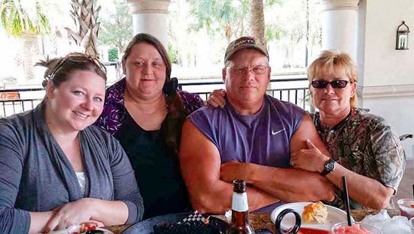 Doug Prince, center, meets with his sisters, from left, Danielle, Rhonda and Diana in Florida. -- SUBMITTED