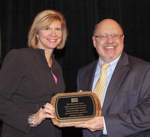 For the second straight year, The Tidewater News  was recognized by the Virginia Farm Bureau Federation in agriculture coverage.  Farm Bureau’s Kathy Dixon, left, and The Tidewater News staff writer Stephen H. Cowles. -- SUBMITTED