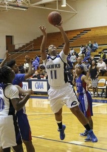 Alisha Mobley goes in for a layup. She led the Hawks with 17 points. Frank Davis | Tidewater News