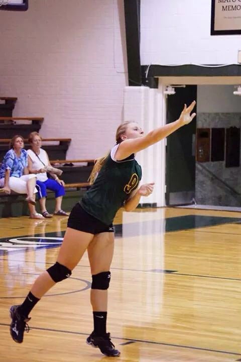 Samantha Billups serves a ball during a Hollins University match this year. Billups was recently honored with an all-conference award for her play as a first-year volleyball student-athlete.
