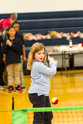 Laney Phillips looks to return a ball back to Lindsay Raulston, who was helping out with the WTTA clinic at S.P. Morton Elementary School.