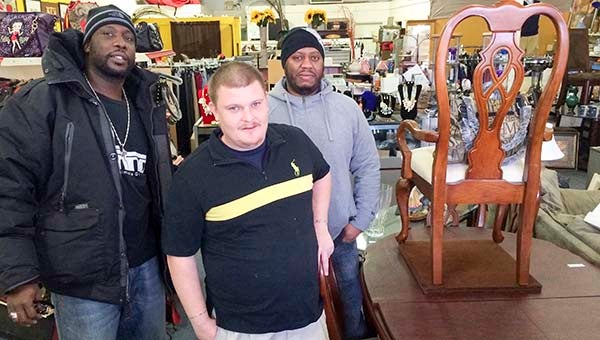 Clyde Bailey, left, of Trinkets and Treasures in downtown Franklin with Jason Drewry and Ibrahim Meriwether. Bailey is part of the Southside Job Network, which is a growing organization to help southside Franklin residents get work. -- Stephen H. Cowles | Tidewater News
