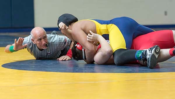 Franklin’s Jack Sykes gets a quick pin against Southampton’s Cameron Houg. -- Murray Thompson | Tidewater News