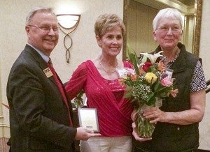 Barbara Ridenhour, right, receives an award for her contribution to establishing the nursing program at the college. At left are Dr. Paul Conco, president, and Linda Chitwood, assistant professor. -- Stephen H. Cowles | Tidewater News