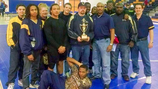 The Franklin High School Broncos wrestling team won the Conference 41 Championship! Pictured with the trophy are, from left, Josh Johnson, Gerrell Porter, Kendall Brown, Jack Sykes, Stephen Flournoy, head coach Daniel Johnson, Cameron Bullock, Ta’Quan Wiggins, coach Guy Freeman, Tyrique Warren, coach Johnny McKeller, coach Sumner Bradshaw and Stefone Pearson, in front. -- SUBMITTED