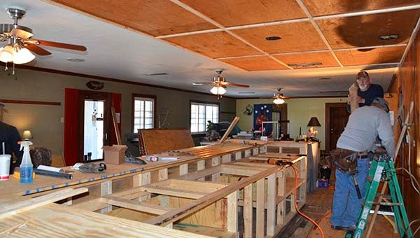 A behind-the-bar view of the new front counter and bar area of Whitley’s Bar-B-Que, currently under construction. Pictured working in the area are John Lopez and Ronnie Cole. -- JIM HART | The Tidewater News