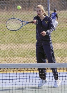Erin Karmilovich of the Lady Broncos returns a forehand shot in a singles match against Surry. -- Frank Davis | Tidewater News