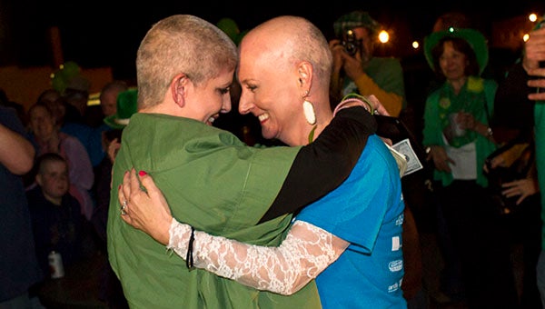 Naomi Koontz, left, and friend Jackie Cutchin stand together with shaved heads. Koontz shaved her head for St. Baldrick’s in honor of Cutchin, who is going through breast cancer treatment. -- Cain Madden | The Tidewater News