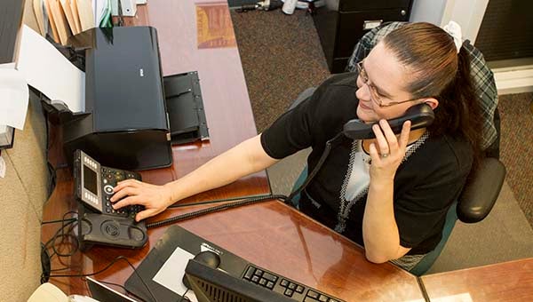 Teresa L. Rose-McQuay, who is the administrative assistant for human resources and receptionist for the city’s administration, works on the old phone system. Recently, it has created concerns as city residents have not been able to call in. -- Cain Madden | Tidewater News