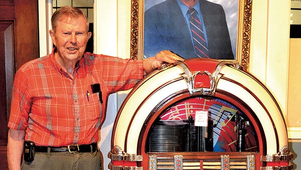 Brinson Paul stands with a vintage Wurlitzer jukebox, among the 13,000-plus on display in the Brady Jefcoat Museum in Murfreesboro. -- COURTESY | TIM FLANAGAN