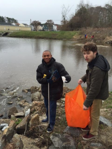 Members of the Paul D. Camp Community College team clean up trash in Franklin on Clean Rivers Day. -- SUBMITTED 