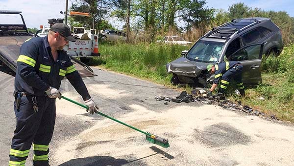 Crews work to clean up the wreckage from Wednesday's head-on collision on Story's Station Road -- Andrew Lind | Tidewater News