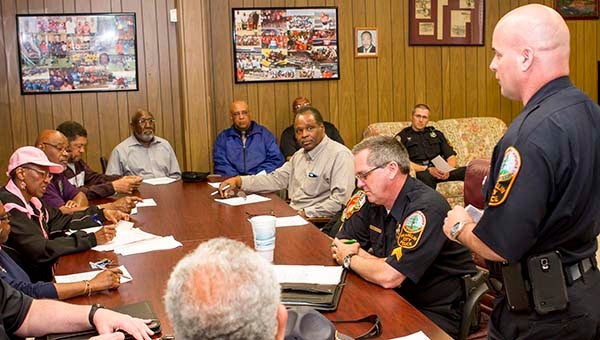 Franklin Police Chief Phil Hardison speaks to members of the Berkley Neighborhood Watch group about police in the news around the nation. -- Cain Madden | Tidewater News