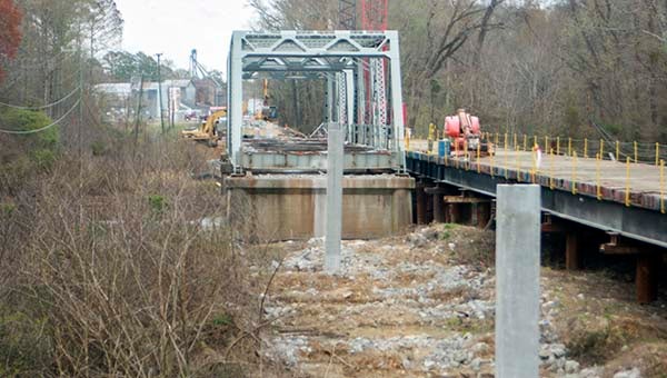 The roadway has been removed from the Route 35 bridge structure. Beside it is a temporary wooden structure designed to support workers and equipment. -- Andrew Lind | Tidewater News