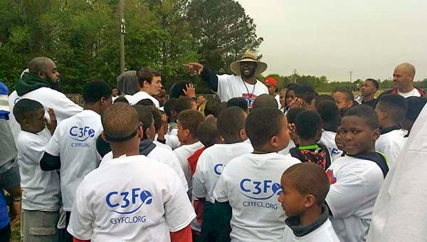 Cover 3 Foundation founder Greg Scott talks to the football participants gathered at the sixth annual Spring Cover 3 Football and Cheer Camp. -- SUBMITTED