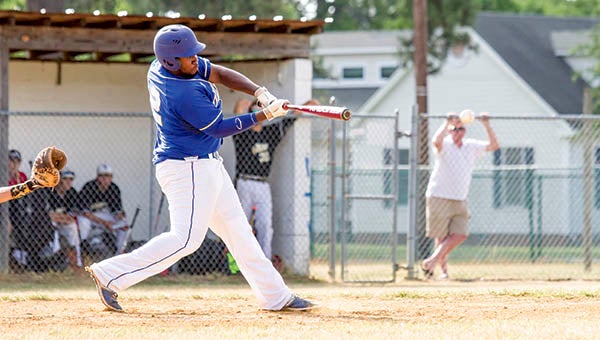 Junior first baseman Gregory Ashburn sends a two-hopper through the infield during his first at-bat on Wednesday. The slugger ended the day 2 for 3 with an RBI. -- Cain Madden  | Tidewater News