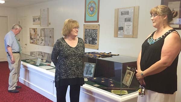 Annie Sykes, center, talks with Audra Anderson in the mini-museum, which opened last Sunday afternoon in Boykins. -- Stephen H. Cowles | Tidewater News