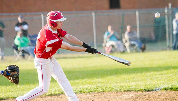 Sophomore Nash Warren hits a blooper earlier this season against Windsor. On Tuesday, Warren had the hit that would send in the go-ahead run for the Indians across home plate. -- Cain Madden | Tidewater News