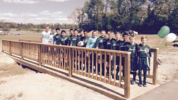The Rock Church Lions pose on a bridge that leads to the new soccer field. It is dedicated to Danny Dillon's grandmothers Sally Dillon and Phyllis Lakeman.