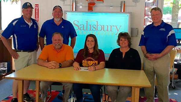 Southampton Academy’s Brooke Mizelle, center, signs her letter of intent to play softball at Salisbury University. She is pictured with her parents, Barry and Patty Mizelle; standing are coaches Jeb Bradshaw and Scott Speight, at left, and athletics director Dale Marks.