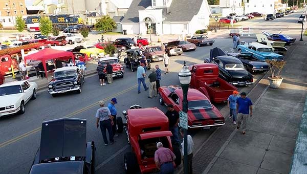 People, hot rods and antique cars line the streets of downtown Franklin during the finale of the Franklin Cruise-In. The event brought in 100 cars, and this evening organizers hope to have 30-40. -- SUBMITTED