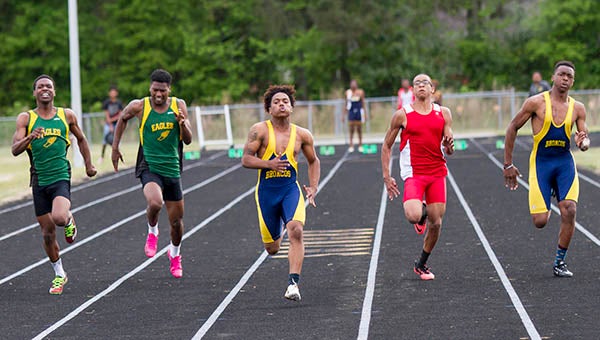 Javonte’ Baker, center, and Jawun Walton, far right, rush toward the finish in a meet earlier this year. Both are part of the boys 4x100 relay team, which has qualified for the VHSL 1A State Outdoor Track and Field meet. -- Cain Madden | Tidewater News